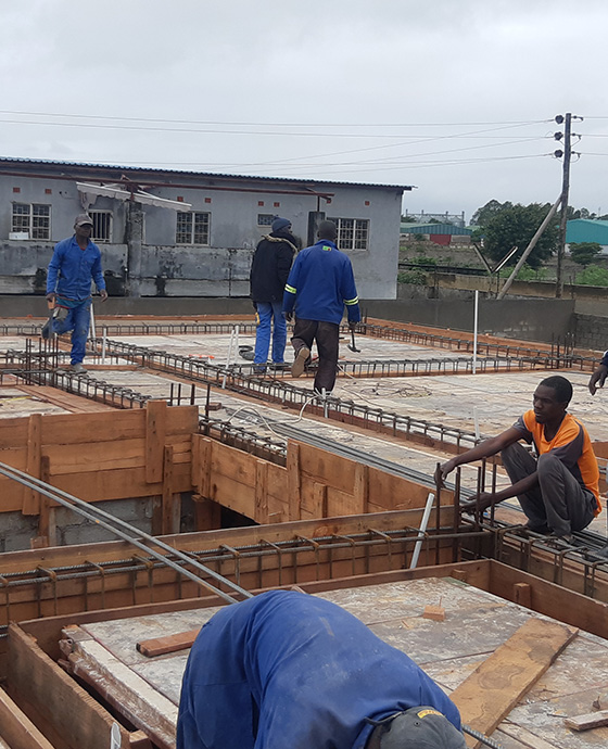 Workers building a house